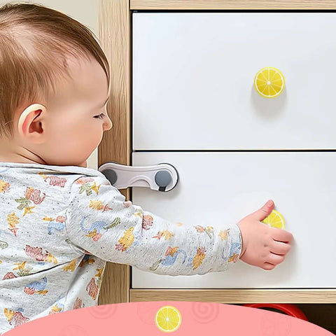 Child reaching for Six Piece Set Lemon Yellow Cartoon Cabinet Drawer Knobs Super Soft Rubber Pulls With Rust Proof Zinc Base.