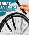 Portable Bike Repair Stand Kit For Bicycles And E Bikes With Maintenance Brackets Pry Bars in use on a bike wheel