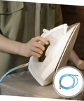Person ironing with steam iron connected to High Pressure Steam Hose For Steam Iron Three Meter Length Heavy-Duty High Temperature Tubing Replacement