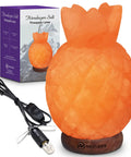 Pineapple-shaped Himalayan salt lamp with wood base and dimmer cord packaging.