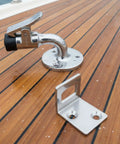 Top Notch Marine Door Stopper With 90 Degree Holder And Rubber Tip For Boats Rvs Campers To Keep Doors Locked Stable Using Durable Stainless Steel That Protects Paint And Handles Heavy Vib on a wooden boat deck.