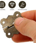 Antique Bronze Hinge Set For Wooden Boxes And Cabinets, 30x27mm iron hardware shown in hand, flush mount for DIY projects.