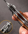 Close-up of Custom Damascus Steel Folding Knife With Wooden Handle And Separate Compass In Wooden Gift Box Go To EDC Outdoor Knife For Camping Fishing Hunting And Survival Perfect Fathers Day Gift For Dad Or Boyfriend showing side view mechanics.
