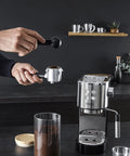 Semi Automatic Espresso Coffee Maker With Built In Steam Wand And High Pressure Pump For Rich Creamy Shots, user adding coffee grounds.