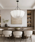 Finktonglan 19.7" White Pleated Fabric Chandelier, Farmhouse Pendant Light for Dining Room above wooden dining table.