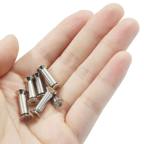 Hand holding 10 Pcs Knife Handle Screws and Fasteners Set, Silver Hex Flat Head Screws for Blade Fixing, DIY Projects, M4 Shafts