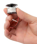 Hand holding DC Five Point Nine Volt Spindle Motor For DVD CD Players With Metal RF300FA12350 Micro Motor Replacement Part
