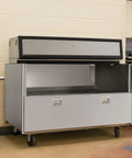 Rock Solid Double Sided Milk Cooler Built Tough For School Cafeterias featuring sliding doors and stainless steel design.
