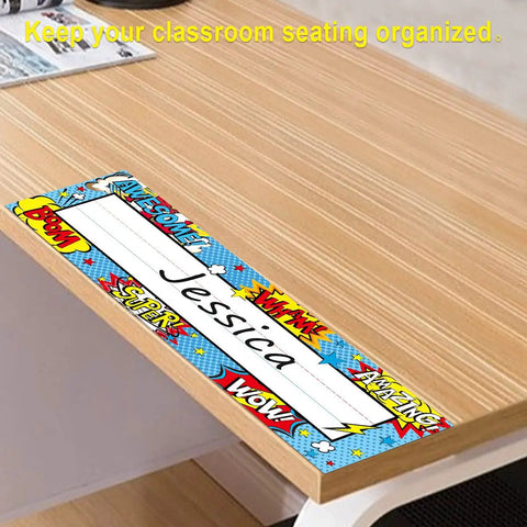 Image of a 36 Pack Classroom Name Plates For Kids With Large Writing Space on a wooden desk, showing colorful design and name 'Jessica'. 