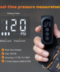 On-The-Go Mini Bike Pump With Gauge showing 120 PSI on digital display held in hand, highlighting real-time pressure measurement.