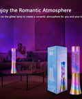 Color Changing Glitter Lamp USB Powered Mood Light For Bedrooms And Parties Teens And Kids Gift Floating Sequins Vibe Lamp Neon Decor For Adults And Youths next to its packaging in a dim-lit living room setting with a couple on the couch.