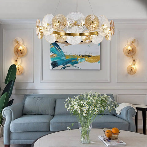 Living room with set of 2 gold wall sconces, brass finish, glass shade, modern decor, cozy ambient glow