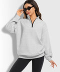 Model wearing Oversized Womens Hoodie Sweatshirt Quarter Zip Pullover For Fall And Winter With Soft Fleece Lining Long Sleeve Grey Cozy And Comfy