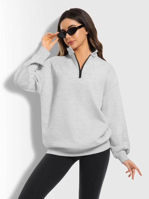 Model wearing Oversized Womens Hoodie Sweatshirt Quarter Zip Pullover For Fall And Winter With Soft Fleece Lining Long Sleeve Grey Cozy And Comfy