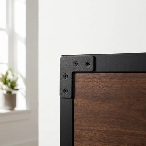 Close-up of 20 Pack Black Stainless Steel L Corner Brackets 1.6x1.6 Inch Thickened Right Angle Support Brace on wooden furniture corner.