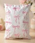 Pink Bow Poly Mailers 10x13 Inch 200 Count Heavy Duty Waterproof Self Adhesive Shipping Bags For Boutique Shops Small Biz And Gift Packaging Options Today, showcasing water resistance with floral background.