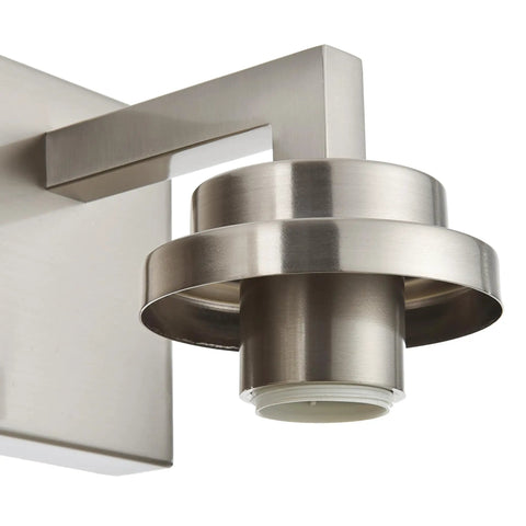 Close-up of the Three Light Vanity Light Fixture in Brushed Nickel with Clear Glass Shades for Modern Bathrooms focusing on fixture detail.
