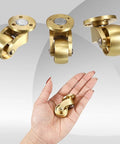 Sturdy Brass Casters Set For Moving Trunks Boxes Workbenches And Cabinets With Silent Swivel Wheels shown in hand for scale