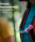 Osprey Hydraulics bite valve replacement with clear hose and pink valve on backpack hydration tube.