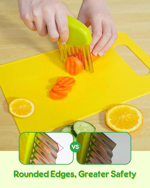 Kids kitchen knife set with green-handled crinkle cutter slicing carrots on a yellow cutting board