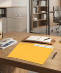25 Pack Manila Self Seal Envelopes 9x12 Catalog Mailers With Kraft Finish on office desk with lamp and files