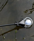 Water Golf Ball Retriever Telescoping to 15 Feet with Ergonomic Grip Handle retrieving ball from water hazard