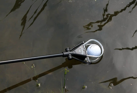 Water Golf Ball Retriever Telescoping to 15 Feet with Ergonomic Grip Handle retrieving ball from water hazard