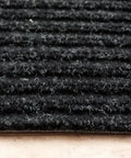 Close-up of a textured beige carpet stair tread from the Beige Indoor 15 Pack Stair Treads Set With Anti Slip Carpet Covers 8x30 Inches Slip Resistant Noise Dampening Gentle Backing Protects Stairs For Elders Pets And Kids Easy To Install And Clean.