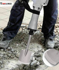 Man using 65A Shank Clay Spade Jackhammer Shovel Bit for concrete demolition with tool close-up inset.