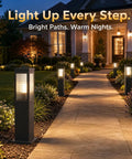Slick Hardwired Outdoor Pathway Lights E26 Socket 23 Inch Tall in landscaped yard along a stone walkway with warm glow.
