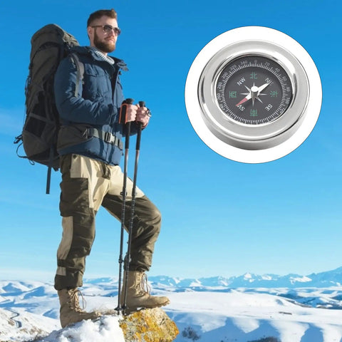 Hiker with Mini Stainless Steel Compass for Camping and Hiking on mountain