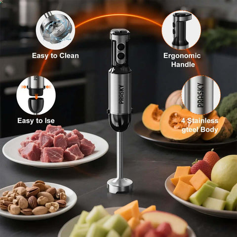 Badass Heavy Duty Immersion Blender With 20 Speed And Turbo Boost Copper Motor Handheld Kitchen Mixer Stainless Steel Blades Milk Frother Whisk Mini Chopper Real Game Changer For Creamy Smoothies And Soups Black with ergonomic handle and stainless steel body, surrounded by chopped meat and fruits.