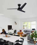 Neojoyoenix 52" 'Flush Mount & Rod ABS 3 Blades Ceiling Fan with Remote Control No Lights, black installed in modern living room.