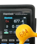 Hantek LCR meter displaying capacitance of ceramic capacitor marked 684 from 600 Piece Ceramic Capacitor Kit With 30 Values, 10pF To 10uF, 50V, 10 Percent Tolerance, Essential For DIY Projects And PCB Repairs, Values Printed On Bags For Quick Visual Identification.