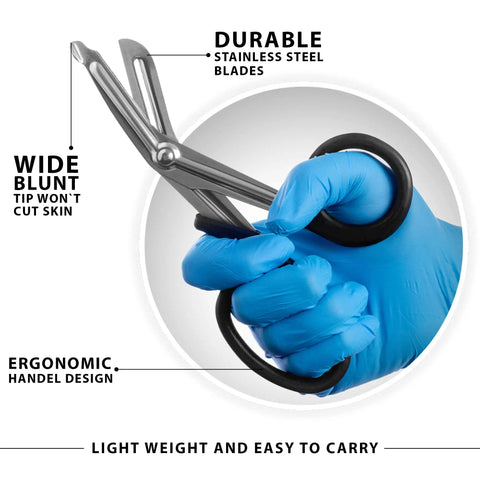 Six Piece EMT Trauma Shears Set With Multi Color Handles And Heavy Duty Non Stick Stainless Steel Blades Ready For EMS Pros Nurses And First Aid Ergonomic Grip For Quick Cuts And Durable Use. Blue-gloved hand holding stainless steel trauma shears