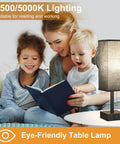 Black Bedside Table Lamp With USB C And USB A Ports, 3 Brightness Levels And 3 Color Temperatures next to family reading