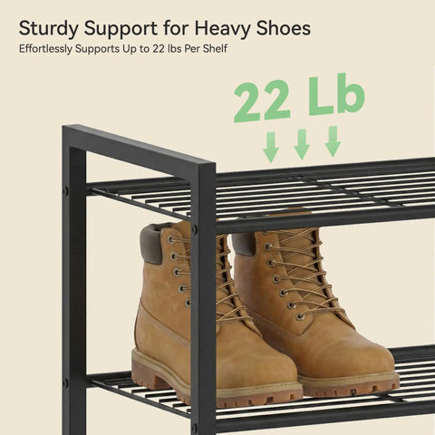 Heavy Duty Ten Tier Metal Shoe Rack Holds Up To Twenty Two Pairs Tall Slim Entryway Organizer With Adjustable Bottom Shelf And Secure Anti Tip Strap For All Your Kicks Black, showing sturdy shelf with two heavy boots.