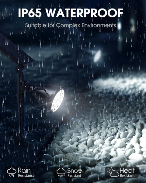 Solar Spot Lights Outdoor Waterproof IP65 showcasing rain and snow resistance, illuminating stones at night, 600LM 18 LEDs.