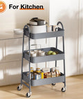 Grey three tier metal rolling cart with lockable wheels in kitchen, heavy duty mobile storage shelf, rust resistant steel, adjustable shelves.