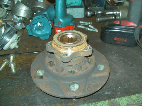 Ford Transit Brake Disc Puller Set on workbench with rotor removal tool and bolts visible