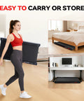 Woman carrying Under Desk Vibration Treadmill With 3 In 1 Vibration Plate For Home Gym; stored under desk and bed.