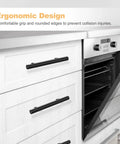 30 Pack 5 Inch Cabinet Handles Matte Black Stainless Steel Drawer Pulls for Kitchen Cabinets with 3 Inch Hole Centers installed on white kitchen cabinets.