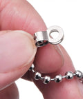 Close-up of hand holding 2 Pack Steel Beaded Ball Pull String Extension Chain With Connectors For Ceiling Fan Light Fixture And Bulb Switch Extender 1 Meter Length Plug And Play