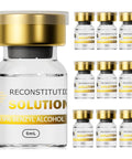 Front view of a large glass reconstitution solution bottle with a gold cap beside nine small 5 mL glass vials arranged in a grid.