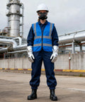 Top Shelf Welding Goggles 4 Pack With Splash Resistant Lens And Impact Rated Frame, worker in safety gear and gloves at industrial site.