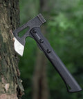 Camping Hatchet For Real Wood Chopping And Outdoor Survival embedded in a tree, showing stainless steel blade and black handle