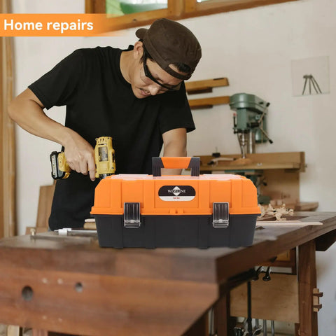 Man using tools near 16.5 Inch Three Layer Folding Tool Box Organizer With Portable Handle for home repairs in workshop setting.