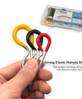 Four colored rubber-coated R-clip hitch pins with steel stems in a plastic case; sizes M3x60, M3.5x75, M4x90