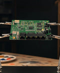 Magnetic Helping Hands Soldering Tool With Flexible Alligator Clip Arms And Magnetic Base holding a PCB for electronics work