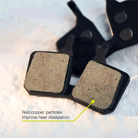 Top Grade Semi Metal Resin Brake Pads Designed For Four Piston Hydraulic Disc Rotors showing surface texture and copper particles.